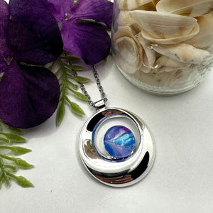 Silver Swirl Pendant with Multicolored Glass Cabochon